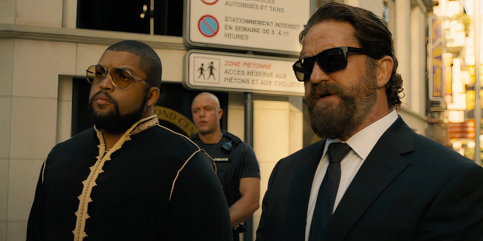 gerard-butler-as-big-nick-standing-next-to-o-shea-jackson-jr-as-donnie-wilson-in-den-of-thieves-2-pantera-3-1.jpg